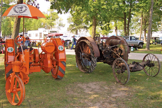 The restored Model B alongside a Happy Farmer Model G owned by Doug Zilmer, Algoma, Wis.